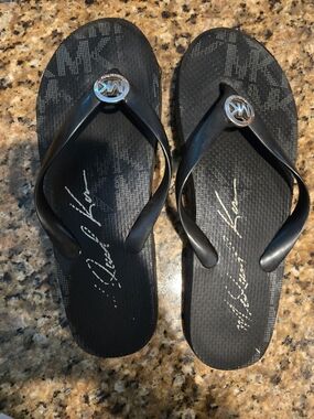 Michael Kors Black Logo Thong Sandals with Silver MK Medallions